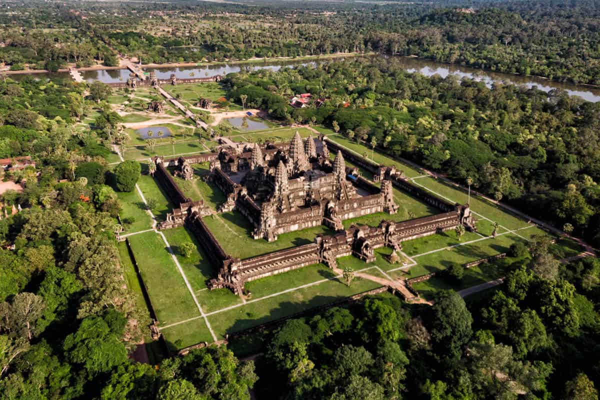 Angkor Wat's rectangular enclosure, moat, and western causeway cross the forest in Siem Reap, Cambodia.