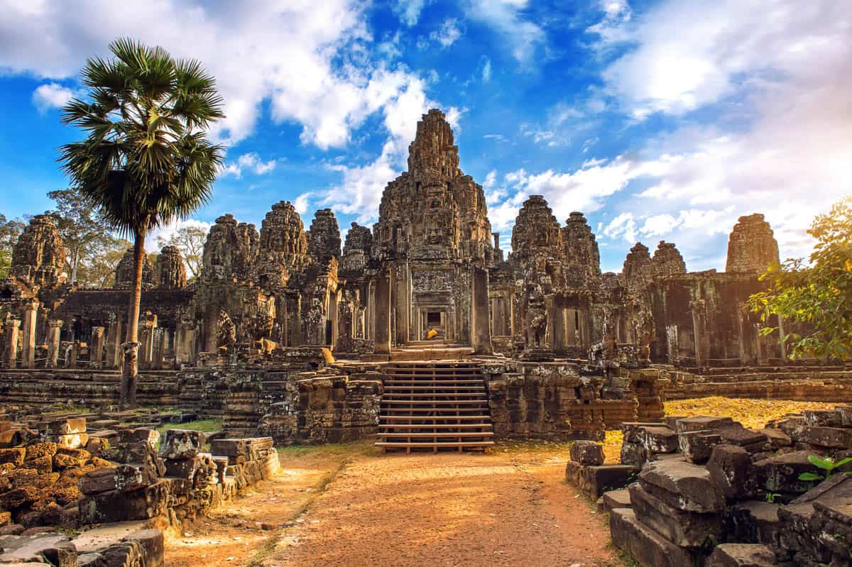 Weathered faces and stepped masonry define Bayon Temple's tower cluster in Angkor Thom near Siem Reap, Cambodia.